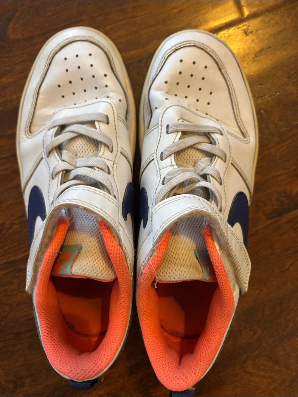 Nike Kids White Sneakers with Blue Swoosh and Orange Lining